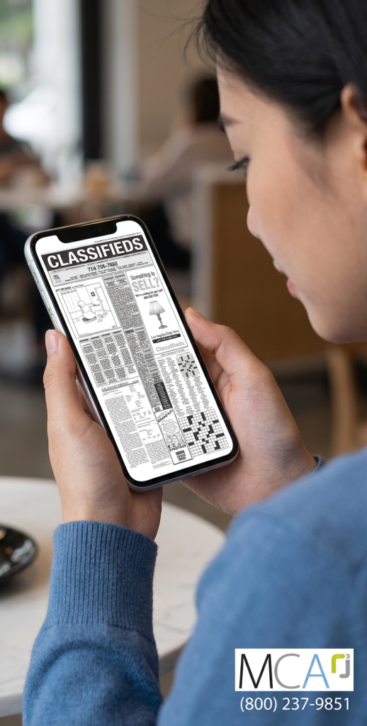 Place Newspaper Advertising in Print or Online person looking at ads on a iphone