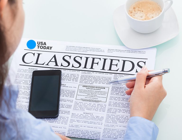 Person looking at job placement ads Place PERMANENT labor certification