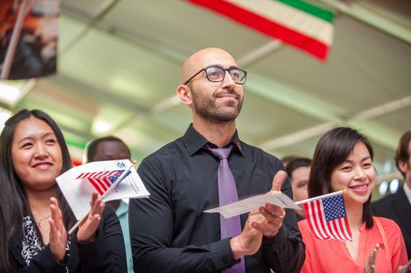 people clapping holding flags place labor certification advertising with my classified ads