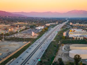 Upland, CA, USA - December 07, 2025: Sunset view of a highway place advertising in california and reach californians